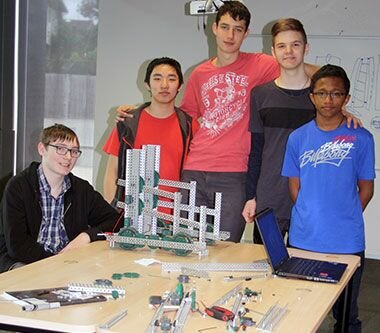 Group of robotics students with their project